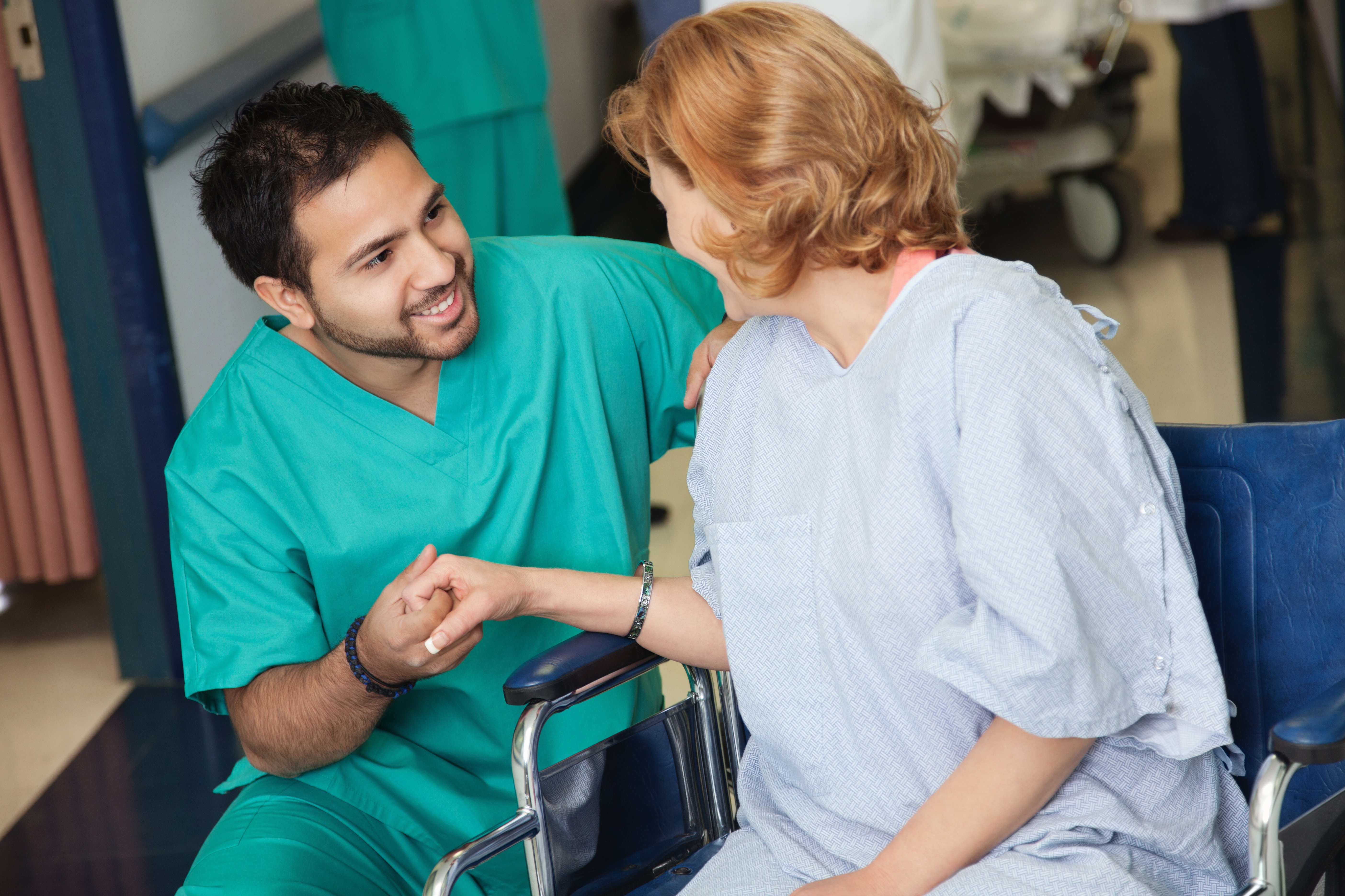 A nurse ensuring he is providing optimal patient care to his patient. 