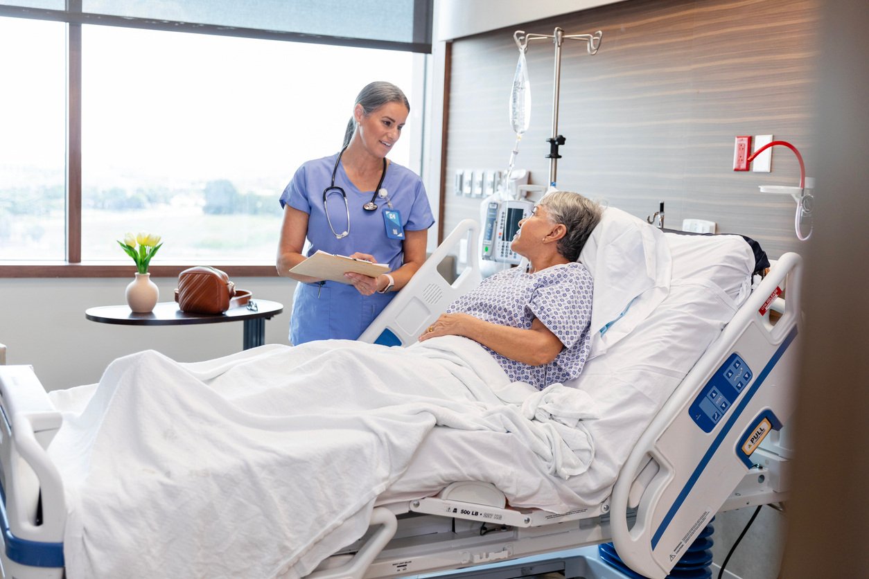 A nurse taking care of her patient.