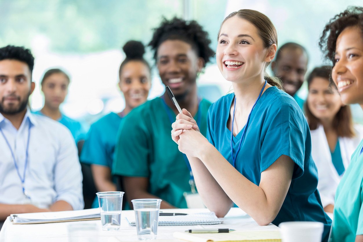 A nurse smiling after implementing smarter staffing strategies